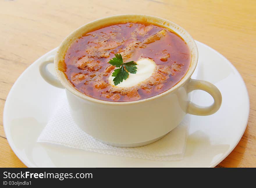 Soup with sour cream on the plate