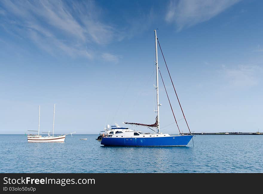 Three yachts in harbour. Summer. Black sea.