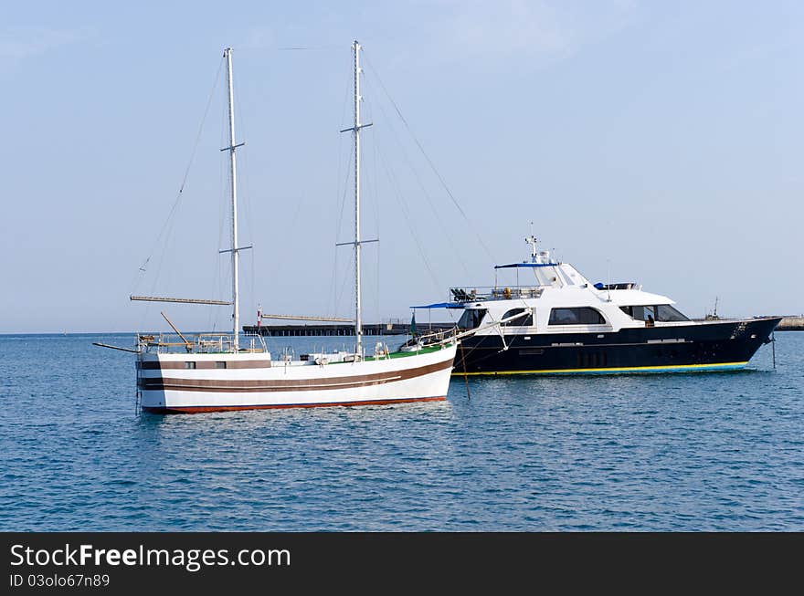 Two yachts in harbour. Summer. Black sea.