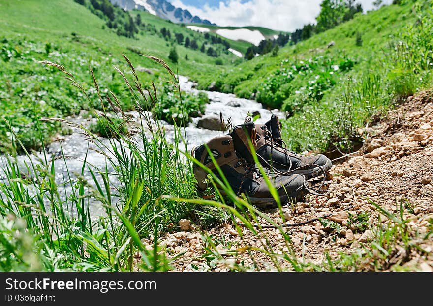 Climbing boots on the rock in the mountains