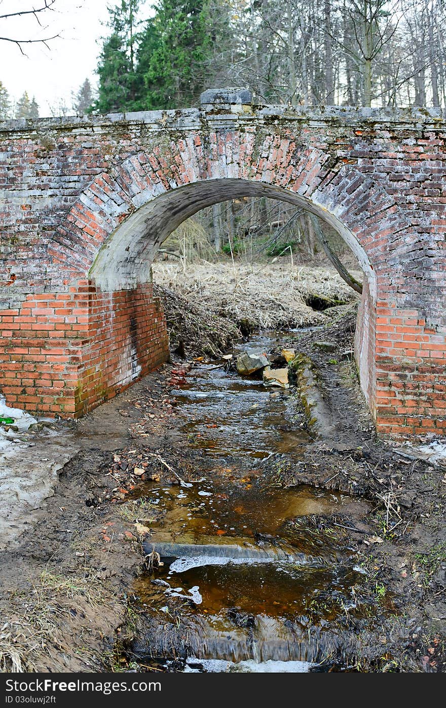 Garbage in river under bridge. Garbage in river under bridge