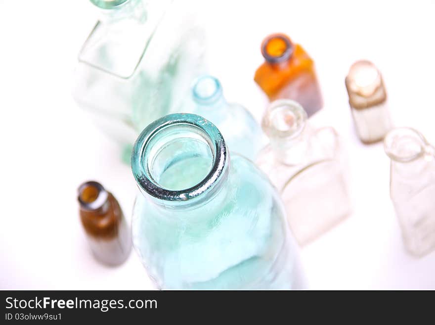 Vintage glass bottles on white