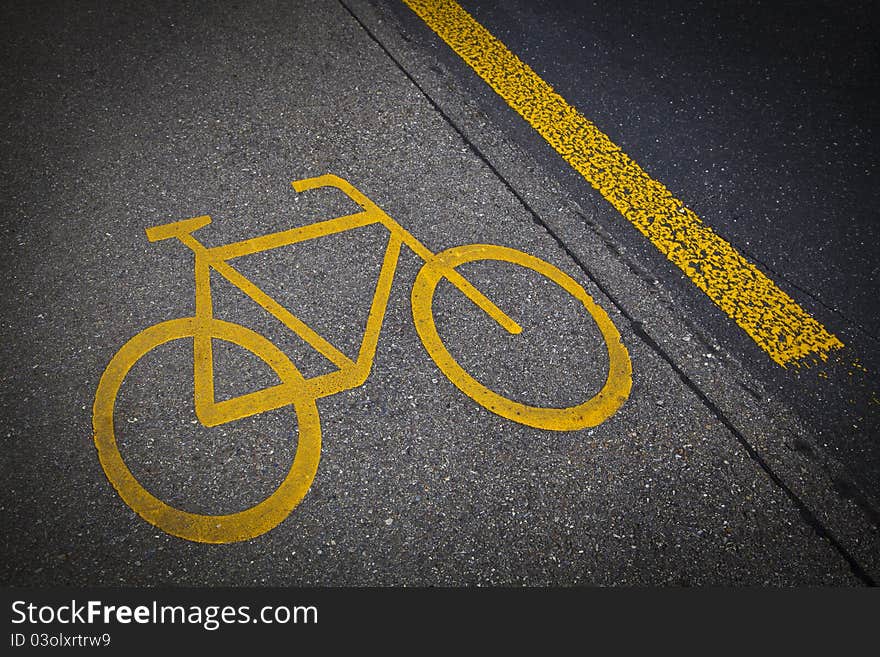 Bicycle road mark in a grey asphalt