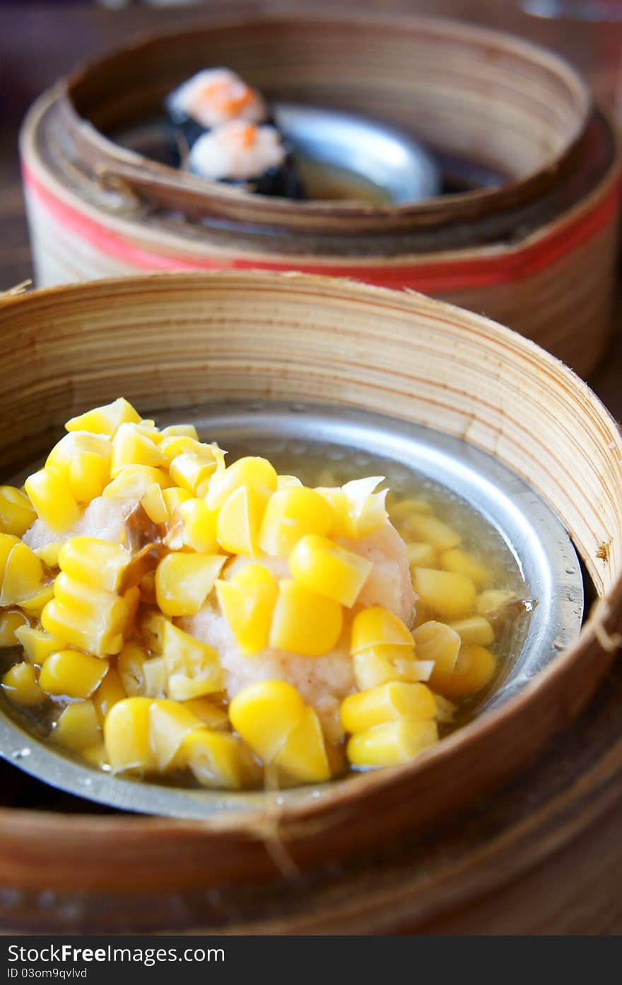 Chinese steamed dimsum in bamboo containers traditional cuisine