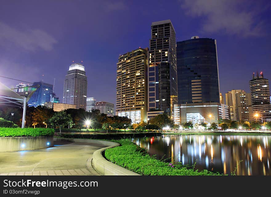 Buildings in the park at night of bangkok. thailand