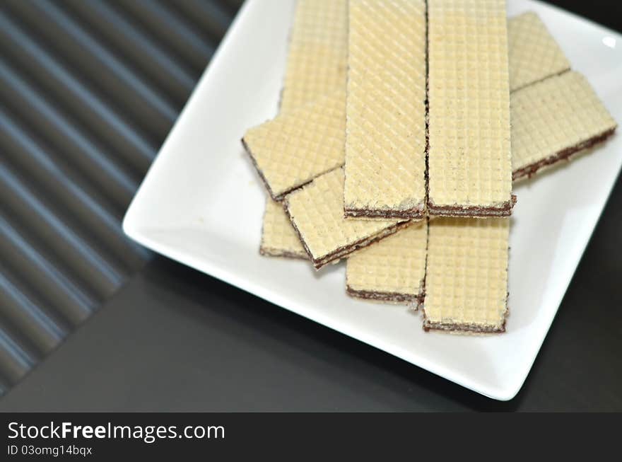 Top view of chocolate wafers placed on a plate. Top view of chocolate wafers placed on a plate.