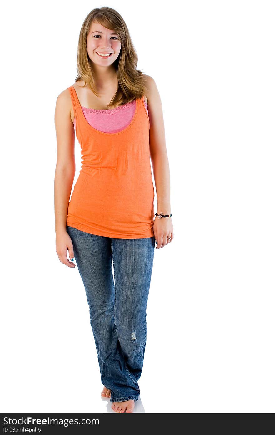 Seventeen year old girl poses wearing tank top with jeans. Seventeen year old girl poses wearing tank top with jeans.