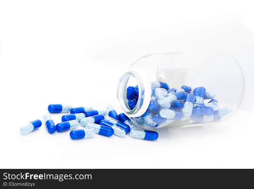 Pills spilling out of pill bottle