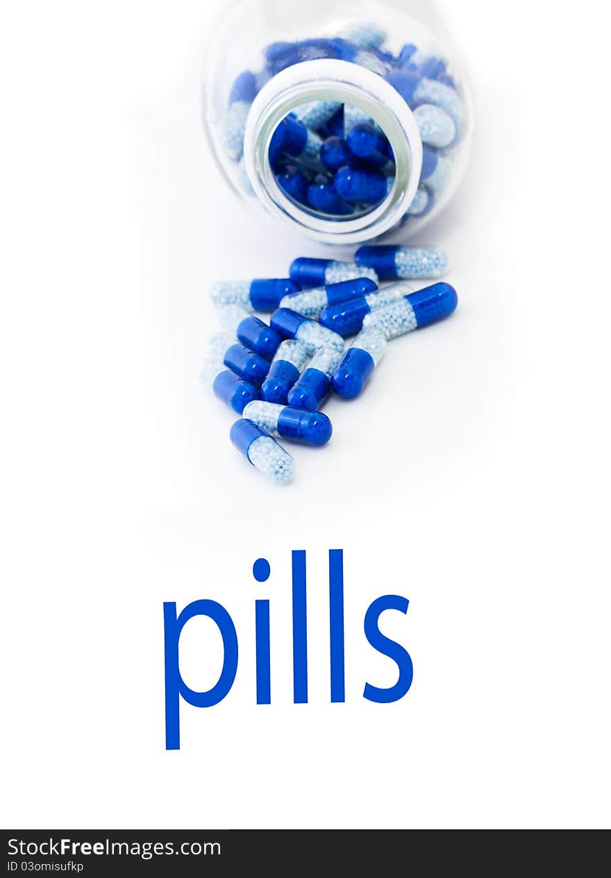 Pills spilling out of pill bottle