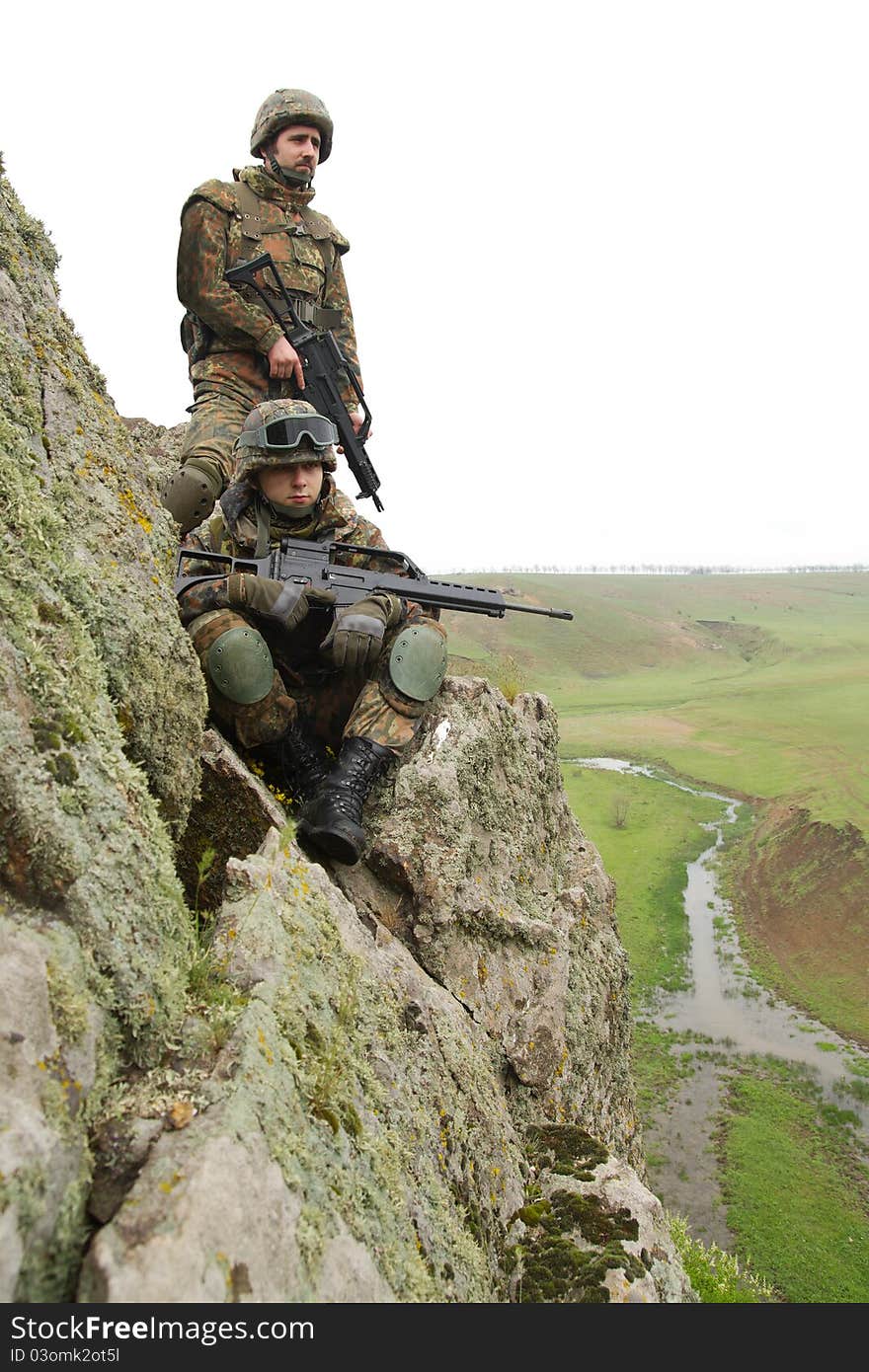 Two soldiers in heavy combative ammunition. Two soldiers in heavy combative ammunition