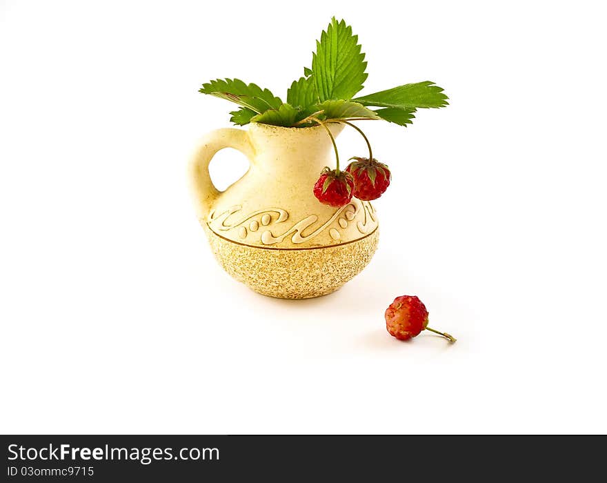 Strawberries in a vase on white