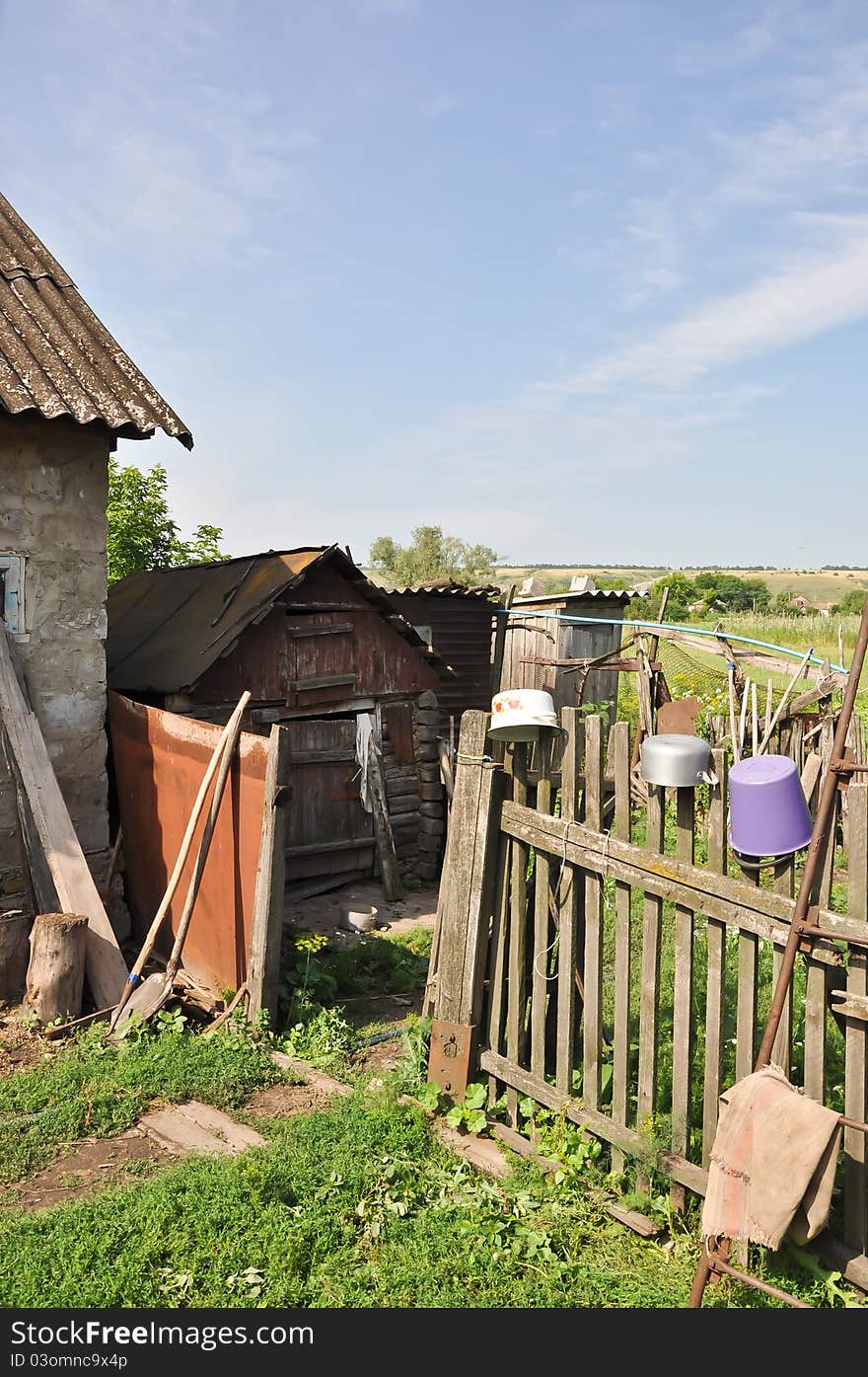 A scene representing a provincial pattern of life with many household utensils and structures. A scene representing a provincial pattern of life with many household utensils and structures.