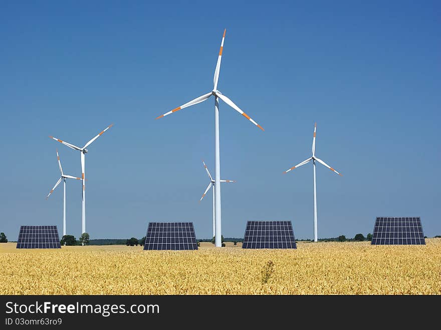 Wind turbine and sunny batteries on blue sky background