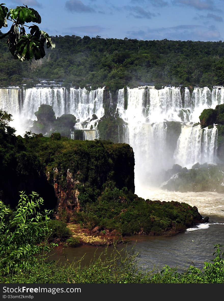 IguazÃº Falls, lie on the Argentina - Brazil border and are a UNESCO World Natural Heritage Site. IguazÃº Falls, lie on the Argentina - Brazil border and are a UNESCO World Natural Heritage Site.