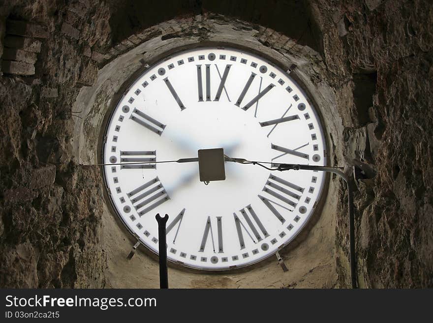 Backside of an old church clock in massa marittima, italy