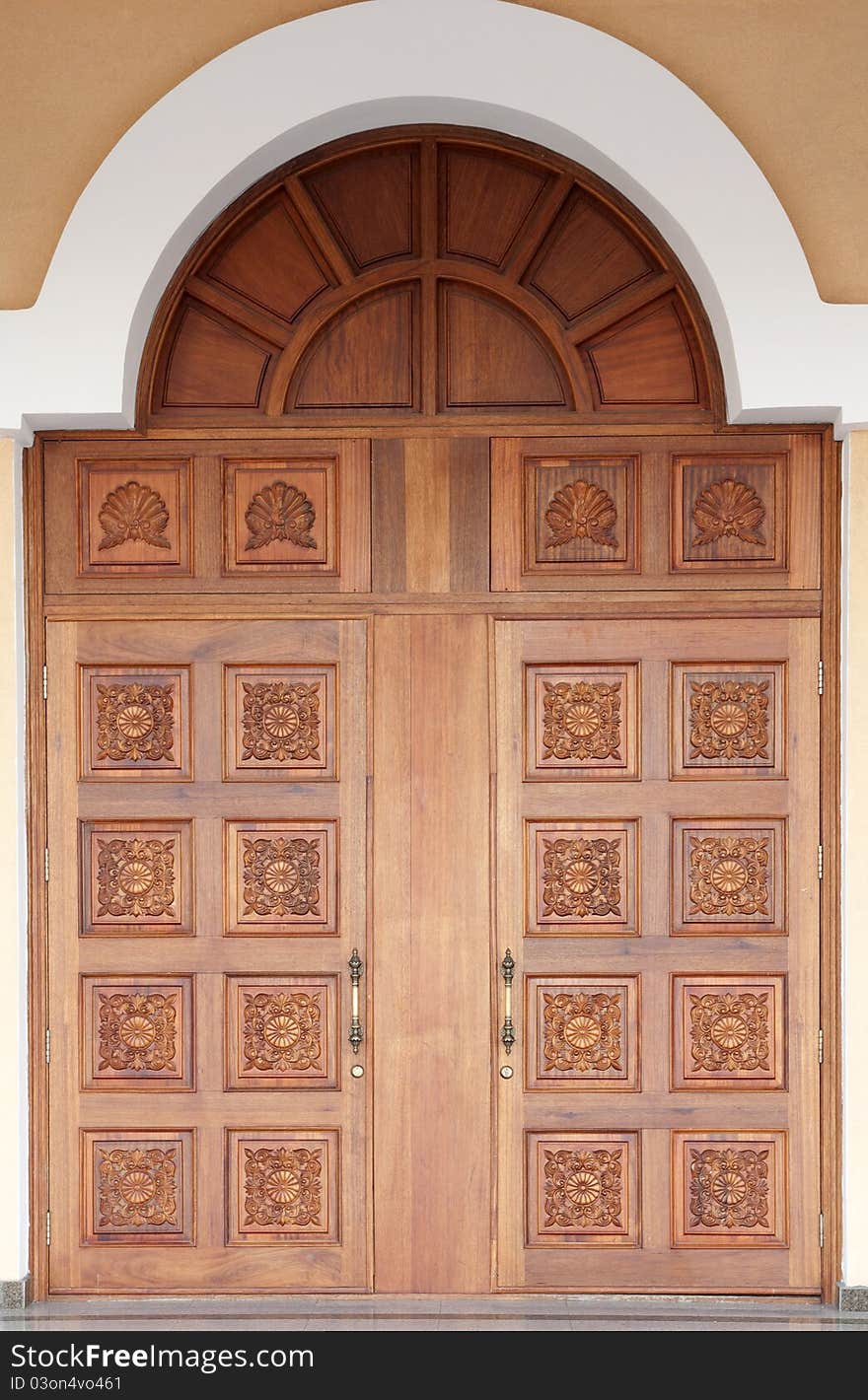 Old-fashioned big carved wooden door. Old-fashioned big carved wooden door