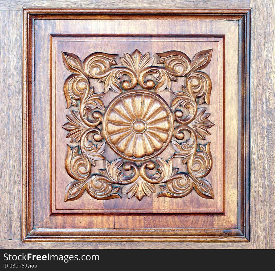 Square old-styled carved wooden ornament