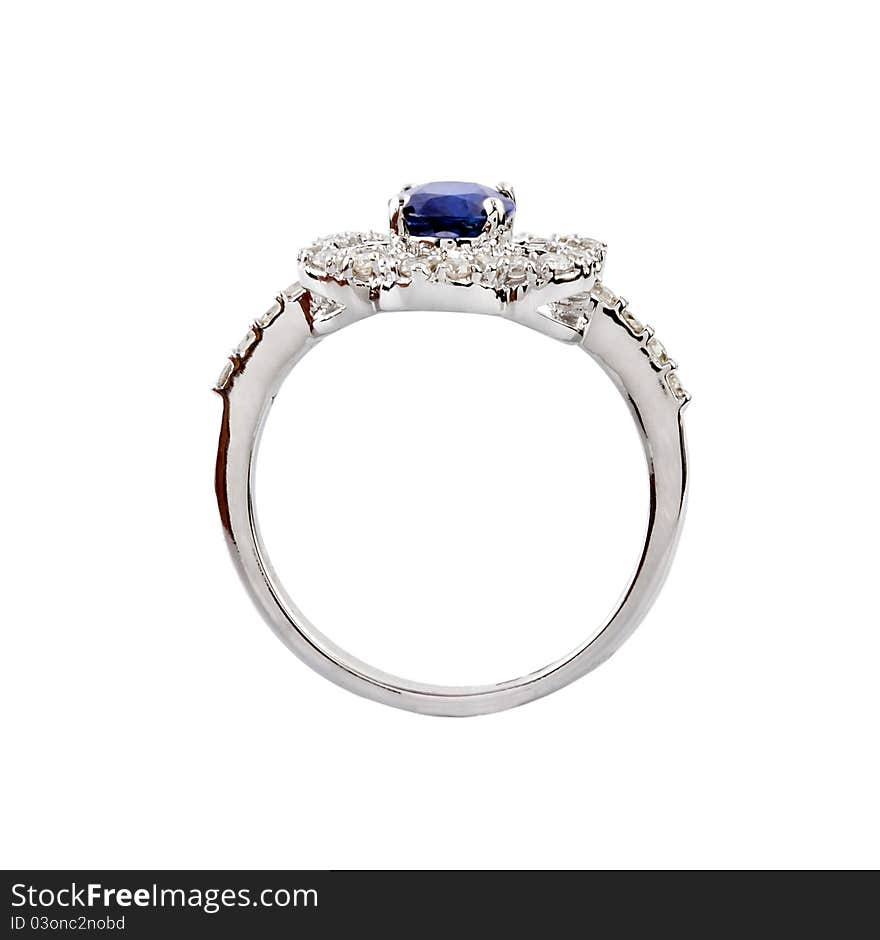 Close -up of diamond ring having big blue gem over white background