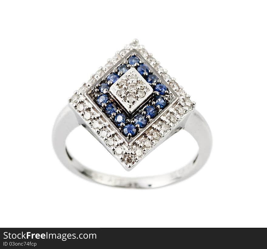 Close -up of diamond ring having many blue gem over white background