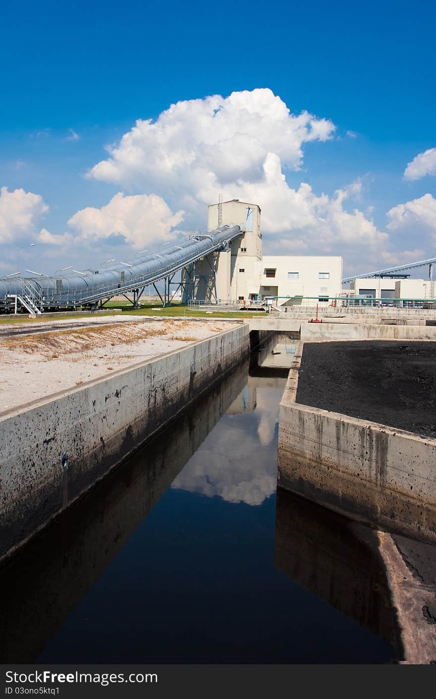 The water flowing from the concrete canal to the waste water treatment systems