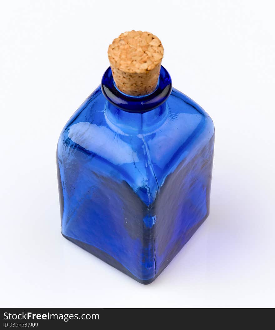 Empty blue bottle with cork