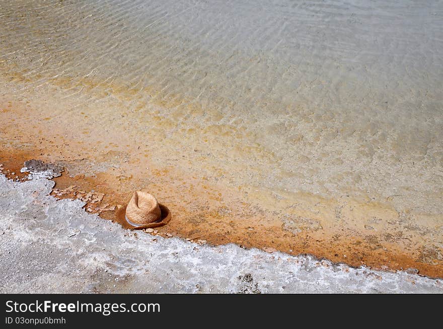 Mans hat in a hot spring in Yellowstone. Mans hat in a hot spring in Yellowstone.