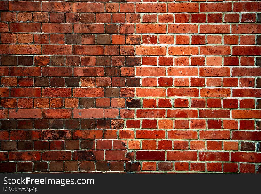 Weathered stained old brick wall background