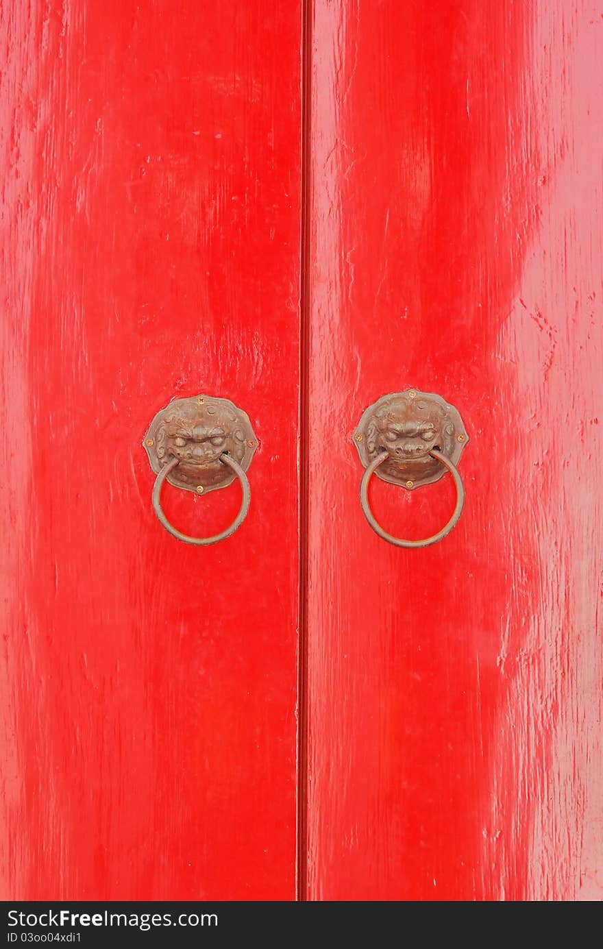 The red door with lion handle in thailand