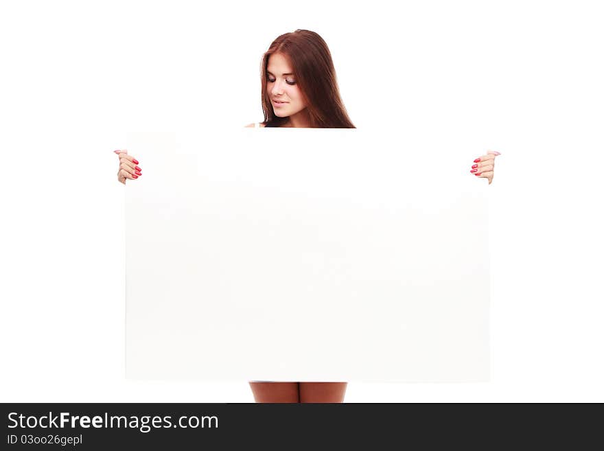 Portrait of a beautiful woman holding a blank billboard, looking out from behind it.