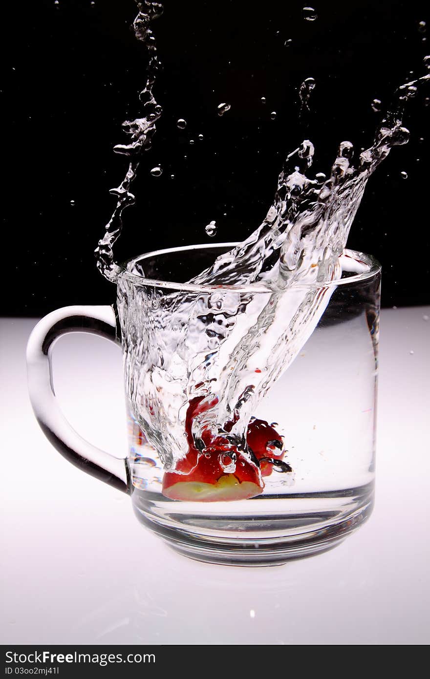 A Fruit drop in water. A Fruit drop in water.