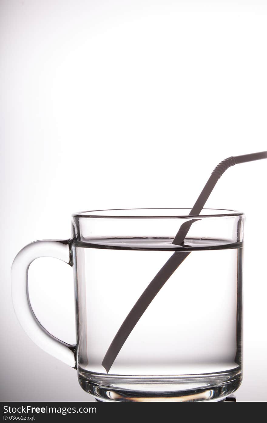 A glass cup with white background.