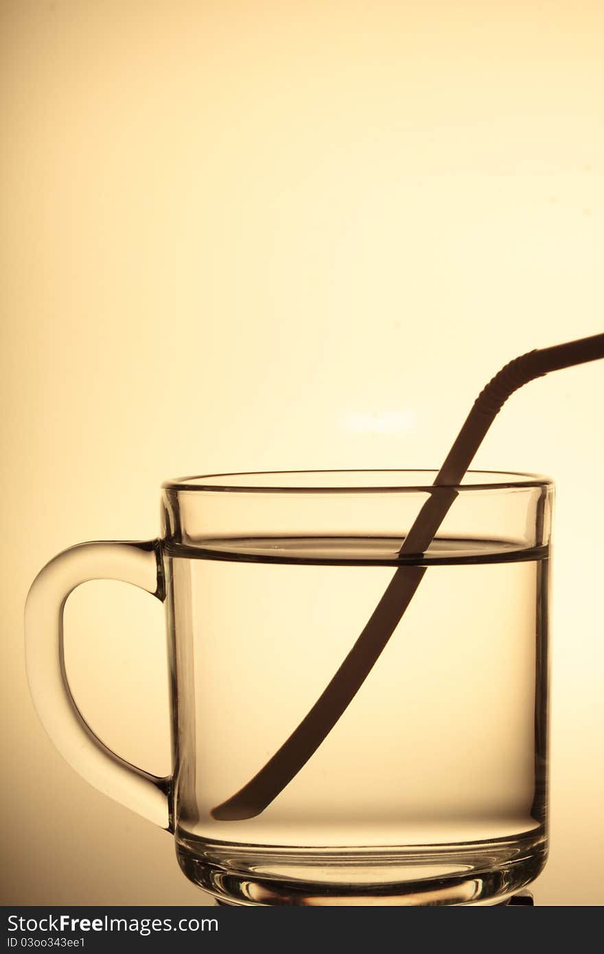 A glass cup with white background.