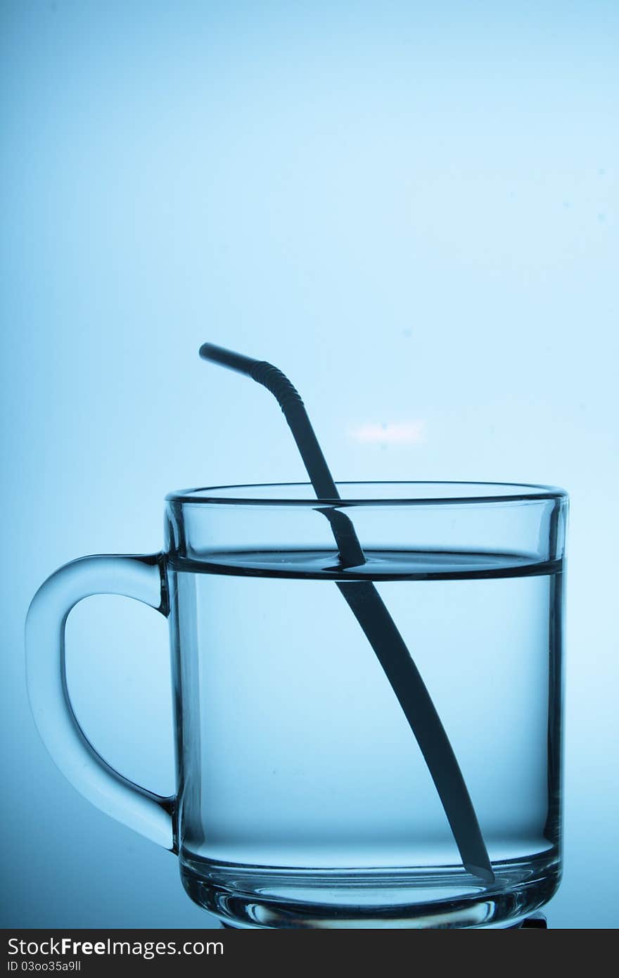 A glass cup with white background.