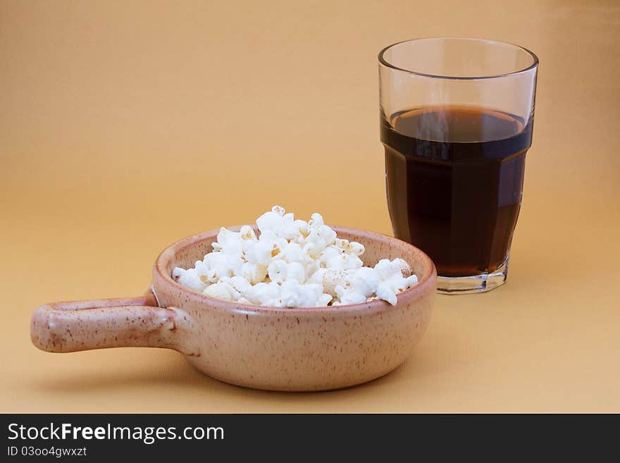 Bowl of pop corn and cola. Bowl of pop corn and cola