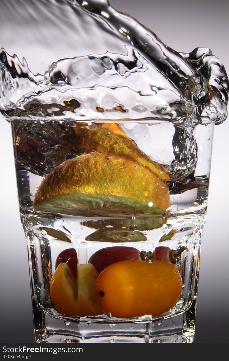 A Fruit drop in water. A Fruit drop in water.