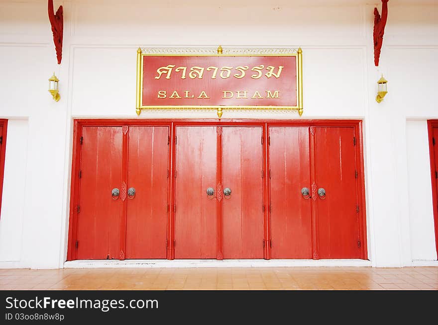 Red doors cosed with old latch