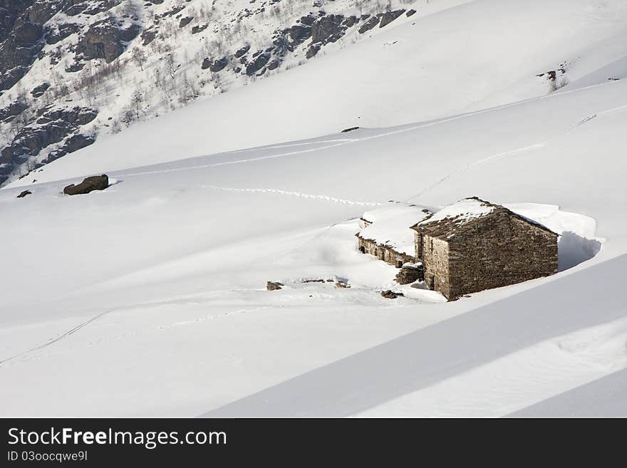 Mountain cabin in the snow in the Alps