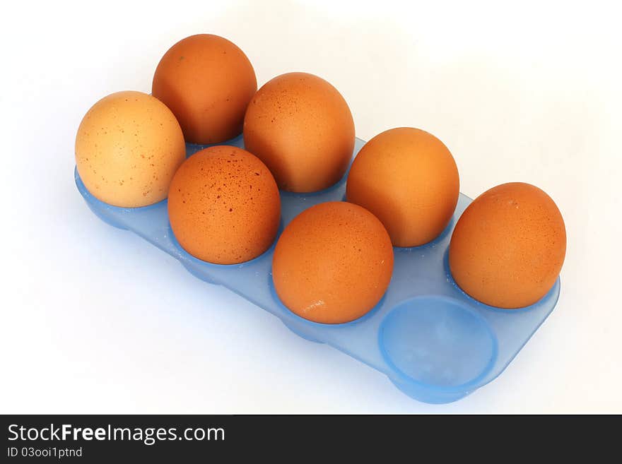 Brown eggs on a white background