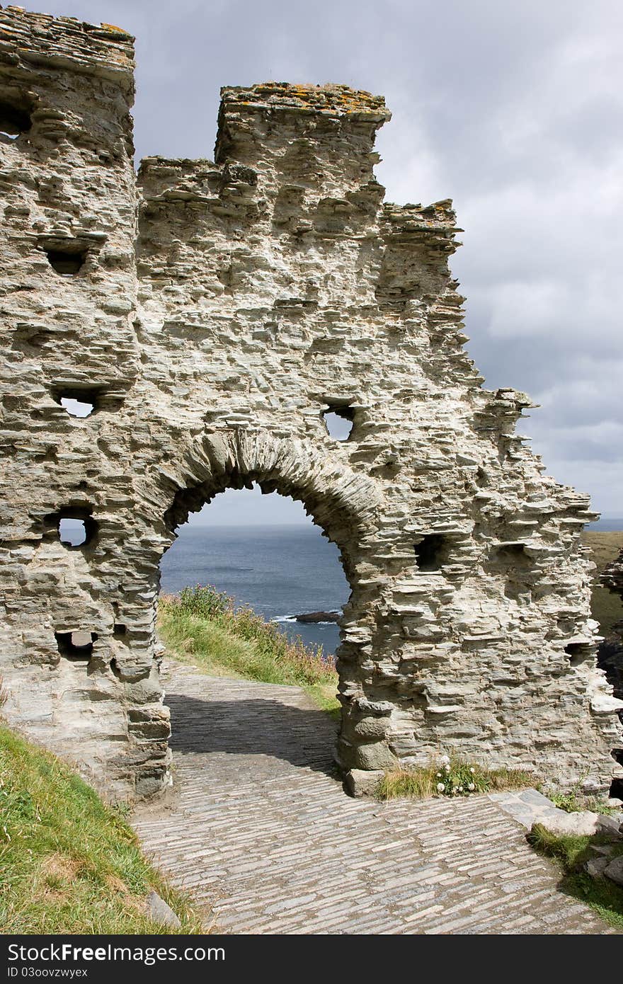 Arch in an ancient crumbling wall. Arch in an ancient crumbling wall