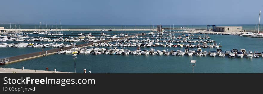 Italy, Siciliy, Mediterranean sea, Marina di Ragusa, panoramic view of boats in the marina