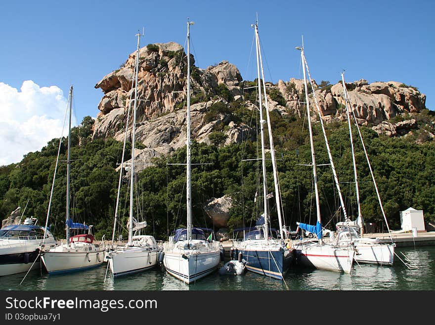 Sailing yachts berthing in Porto Qualtu, Sardinia.