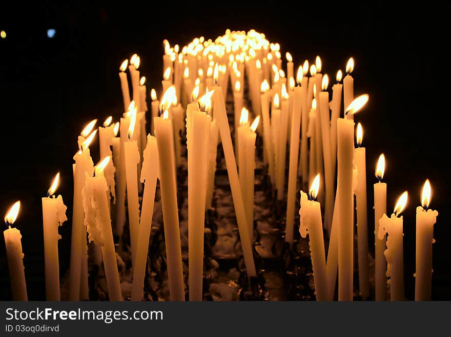 Burning Candles In A Milan Cathedral, Italy.