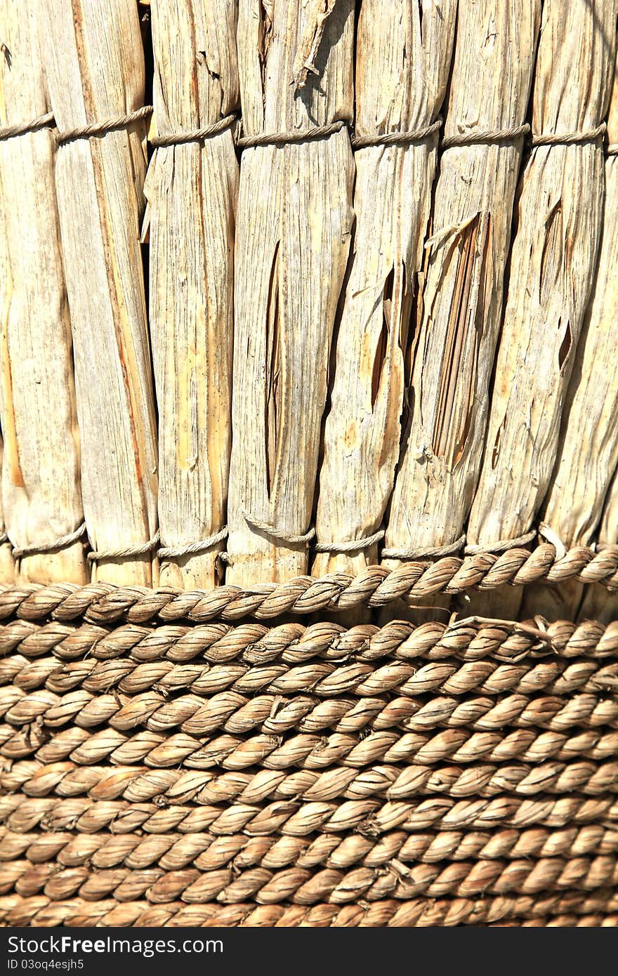 Weathered cane and rope basket in the morning sun. Weathered cane and rope basket in the morning sun.