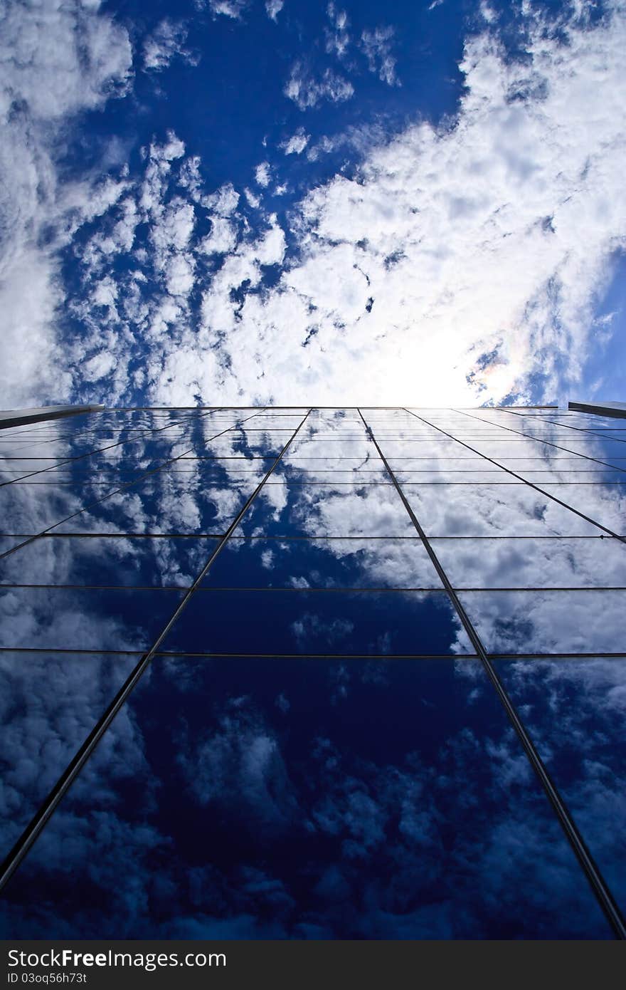 Clouds reflectionon on office building