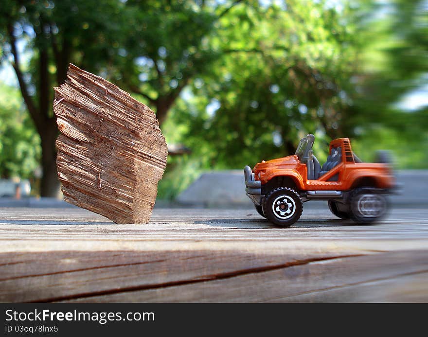 Modern car with blurred background and obstacle