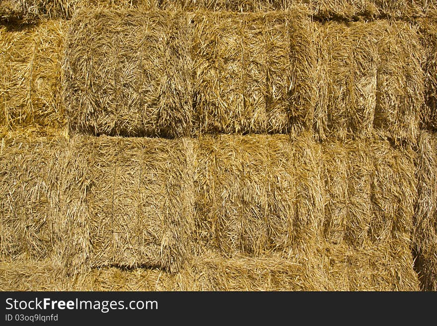 Blocks stacked bales of straw for livestock. Blocks stacked bales of straw for livestock