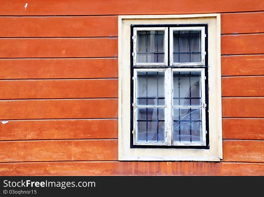 White window on the orange wall in Budapest, Hungary. White window on the orange wall in Budapest, Hungary