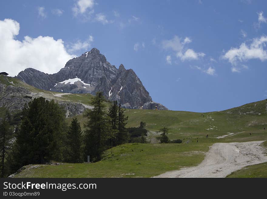 Beautiful landscape of mountains with footpath in Italian Alps