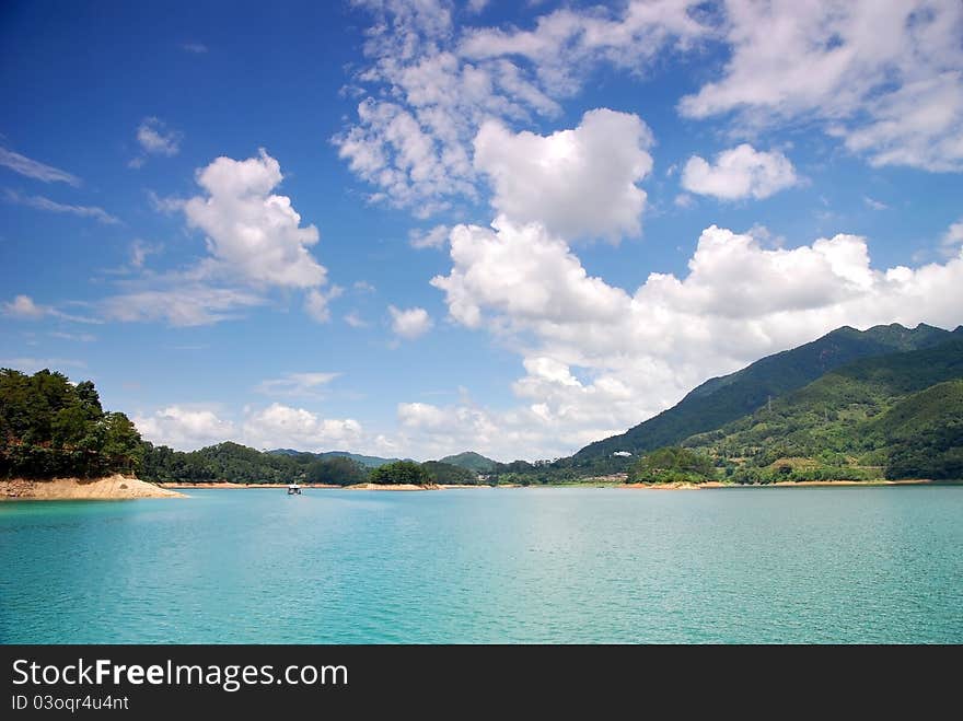 Green Water And Blue Sky