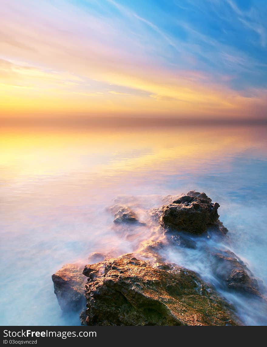 Sea and rock at the sunset. Seascape composition. Sea and rock at the sunset. Seascape composition.